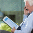 Elderly businessman working at home - Наше Слово